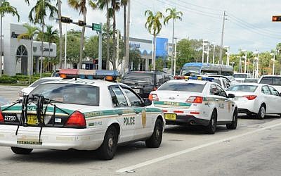 Illustrative: Police are seen in a traffic jam as people leave town during preparations for hurricane Irma in Miami, Florida on September 8, 2017. (Michele Eve Sandberg/AFP)