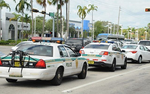 Illustrative: Police are seen in a traffic jam as people leave town during preparations for hurricane Irma in Miami, Florida on September 8, 2017. (Michele Eve Sandberg/AFP)