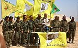 Ahmad Abu Khawlah (5th-R), chief of the Deir Ezzor Military Council -- a coalition of Arab tribes and fighters that belongs to the broader US-backed Syrian Democratic Forces -- speaks during a press conference in the northeastern Syrian village of Abu Fas on September 9, 2017. (AFP Photo/Delil Souleiman)