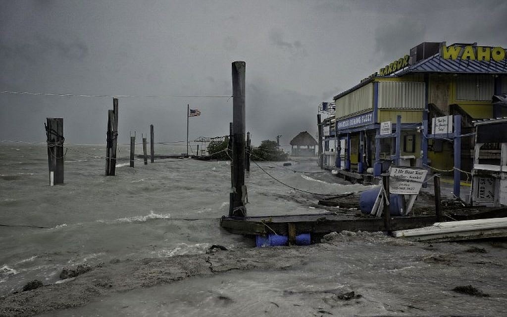Rough surf churned up by the approaching hurricane damages the docks at Whale Harbor in the Florida Keys as winds and rain from the outer bands of Hurricane Irma arrive in Islamorada, Florida on September 9, 2017. (AFP/Gaston De Cardenas)