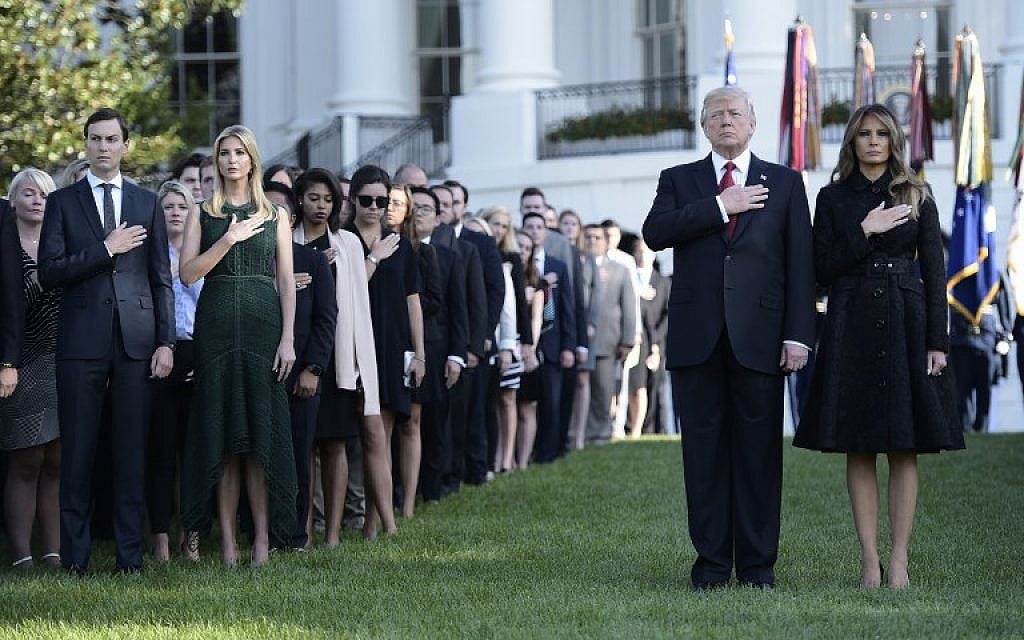 US President Donald Trump and First Lady Melania Trump, senior advisor Jared Kushner (L) and Ivanka Trump observe a moment of silence on September 11, 2017, at the White House during the 16th anniversary of 9/11. (AFP PHOTO / Brendan SMIALOWSKI)