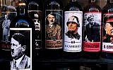 A picture taken on September 14, 2017 shows bottles of wine with pictures of Mussolini, Hitler, Lenin and Stalin at a shop in the center of Rome. (AFP Photo/Alberto Pizzoli)