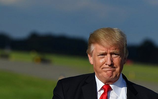 US President Donald Trump walks across the tarmac after stepping off Air Force One upon arrival at Morristown Municipal Airport in Morristown, New Jersey, September 15, 2017. (AFP/MANDEL NGAN) US President Donald Trump walks across the tarmac after stepping off Air Force One upon arrival at Morristown Municipal Airport in Morristown, New Jersey, September 15, 2017. (AFP/MANDEL NGAN)