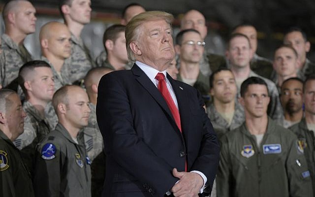 US President Donald Trump waits as he is introduced by First Lady Melania Trump before his address to military personnel and families at Andrews Air Force Base in Maryland on September 15, 2017. (AFP/MANDEL NGAN) US President Donald Trump waits as he is introduced by First Lady Melania Trump before his address to military personnel and families at Andrews Air Force Base in Maryland on September 15, 2017. (AFP/MANDEL NGAN)