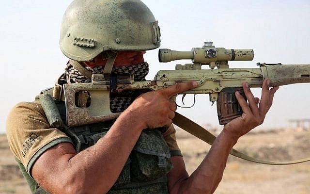 Illustrative: A picture taken during a press tour hosted by the Russian Armed Forces shows a Russian soldier looking through the scope of a sniper rifle on the outskirts of Syria's eastern city of Deir Ezzor on September 15, 2017. (AFP Photo/France2/Dominique Derda) Illustrative: A picture taken during a press tour hosted by the Russian Armed Forces shows a Russian soldier looking through the scope of a sniper rifle on the outskirts of Syria's eastern city of Deir Ezzor on September 15, 2017. (AFP Photo/France2/Dominique Derda)