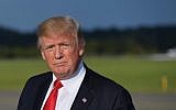 US President Donald Trump walks across the tarmac after stepping off Air Force One upon arrival at Morristown Municipal Airport in Morristown, New Jersey on September 15, 2017.  (AFP Photo/Mandel Ngan)