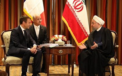 France's President Emmanuel Macron (L) meets with his Iranian counterpart Hassan Rouhani (R) in New York on September 18, 2017, as world leaders gathered in the United States for the UN General Assembly. (AFP PHOTO / LUDOVIC MARIN)