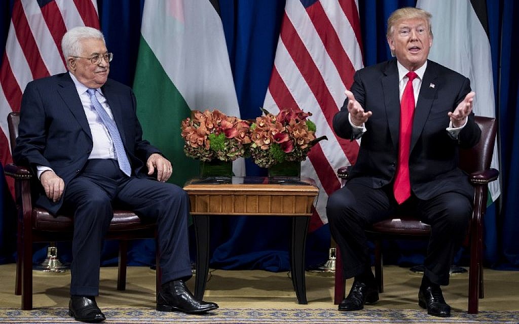 Palestinian Authority President Mahmoud Abbas (L) listens as US President Donald Trump speaks to the press before a meeting at New York's Palace Hotel during the 72nd UN General Assembly on September 21, 2017. (AFP Photo/Brendan Smialowski)