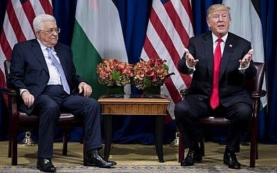 Palestinian Authority President Mahmoud Abbas (L) listens as US President Donald Trump speaks to the press before a meeting at New York's Palace Hotel during the 72nd UN General Assembly on September 21, 2017. (AFP Photo/Brendan Smialowski)