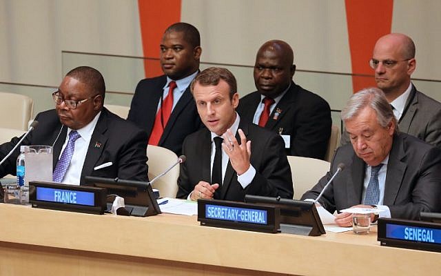 From left to right, front row: Malawi's President Arthur Peter Mutharika, French President Emmanuel Macron and UN Secretary General Antonio Guterres attend the 72nd Session of the United Nations General assembly at the UN headquarters in New York on September 20, 2017.  AFP/ ludovic MARIN)