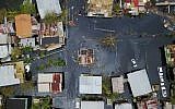 An aerial view shows the flooded neighborhood of Juana Matos in the aftermath of Hurricane Maria in Catano, Puerto Rico, on September 22, 2017. (AFP/Ricardo Arduengo)