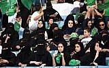 Saudi women sit in a stadium to attend an event in the capital Riyadh on September 23, 2017 commemorating the anniversary of the founding of the kingdom. (AFP PHOTO / Fayez Nureldine)