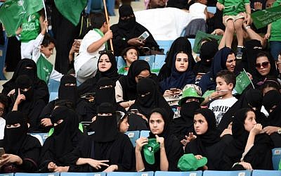 Saudi women sit in a stadium to attend an event in the capital Riyadh on September 23, 2017 commemorating the anniversary of the founding of the kingdom. (AFP PHOTO / Fayez Nureldine)