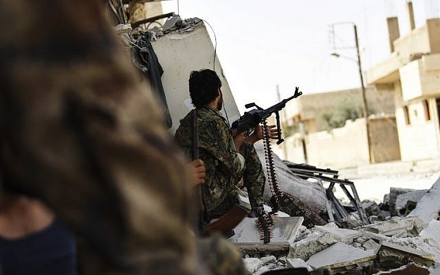 Members of the Syrian Democratic Forces hold a position on the eastern frontline of Raqqa on September 24, 2017. (AFP Photo/Bulent Kilic) Members of the Syrian Democratic Forces hold a position on the eastern frontline of Raqqa on September 24, 2017. (AFP Photo/Bulent Kilic)