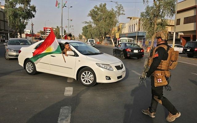 Members of SWAT (Special Weapons and Tactics) security forces, affiliated to the Iraqi Interior Ministry, keep watch as they deploy on the streets after a curfew was imposed on the disputed northern city of Kirkuk, during the vote on the Kurdish independence on September 25, 2017. (AFP Photo/Ahmad Al-Rubaye) Members of SWAT (Special Weapons and Tactics) security forces, affiliated to the Iraqi Interior Ministry, keep watch as they deploy on the streets after a curfew was imposed on the disputed northern city of Kirkuk, during the vote on the Kurdish independence on September 25, 2017. (AFP Photo/Ahmad Al-Rubaye)