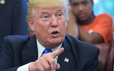US President Donald Trump speaks before signing a memorandum on increasing access to science, technology, engineering and mathematics education in the Oval Office of the White House on September 25, 2017 in Washington, DC. (AFP Photo/Mandel Ngan)