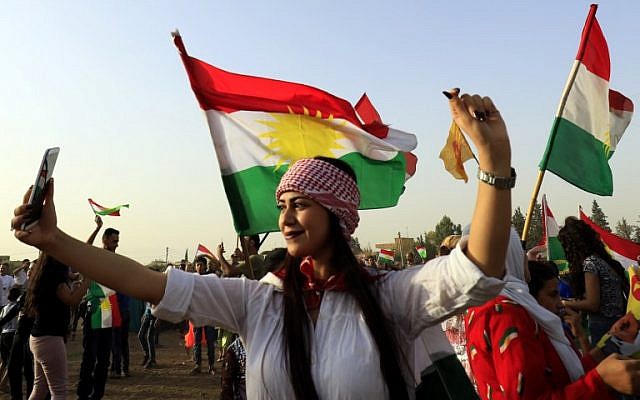 A Syrian Kurd takes a selfie, in the northeastern Syrian city of Qamishli on September 26, 2017, during a gathering in support of the independence referendum in Iraq's autonomous northern Kurdish region. ( AFP/ Delil souleiman) A Syrian Kurd takes a selfie, in the northeastern Syrian city of Qamishli on September 26, 2017, during a gathering in support of the independence referendum in Iraq's autonomous northern Kurdish region. ( AFP/ Delil souleiman)