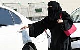 This file photo taken on October 26, 2014, shows a Saudi woman getting into a taxi at a mall in Riyadh. (AFP Photo/Fayez Nureldine)
