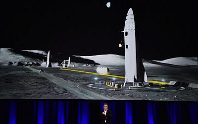 Billionaire entrepreneur and founder of SpaceX Elon Musk speaks below a computer generated illustration of his new rocket at the 68th International Astronautical Congress 2017 in Adelaide on September 29, 2017. (AFP PHOTO / PETER PARKS)