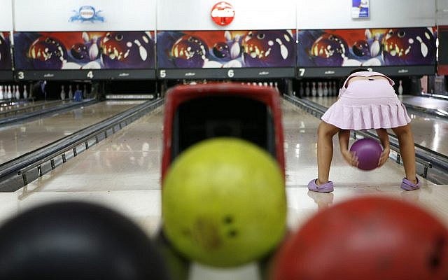 A young girl bowling in Jerusalem on Saturday 12. 2006. (Nati Shohat/Flash90) A young girl bowling in Jerusalem on Saturday 12. 2006. (Nati Shohat/Flash90)