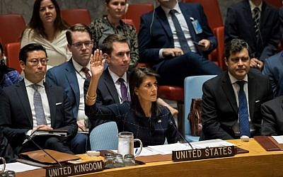 United States ambassador to the United Nations Nikki Haley, center, raises her hand as she votes yes to levy new sanctions on North Korea during a meeting of the United Nations Security Council concerning North Korea at UN headquarters, in New York City,  September 11, 2017. (Drew Angerer/Getty Images/AFP)