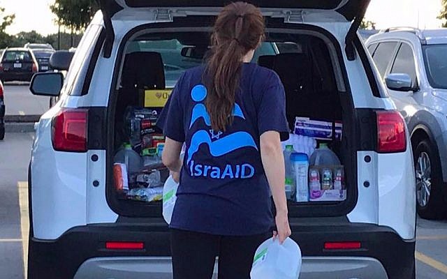 IsraAID team member organizes relief supplies for Hurricane Harvey victims in shelters in Dallas, Texas, August 29, 2017. (IsraAID)