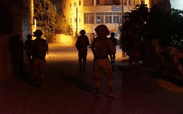 Illustrative: IDF soldiers conduct raids in the West Bank on September 28, 2017. (Israel Defense Forces) Illustrative: IDF soldiers conduct raids in the West Bank on September 28, 2017. (Israel Defense Forces)