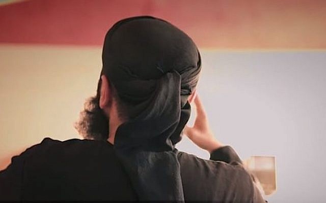 Notorious hate preacher Abu Walaa showing his back in an online video, as has become his trademark. (Screen capture: YouTube) Notorious hate preacher Abu Walaa showing his back in an online video, as has become his trademark. (Screen capture: YouTube)