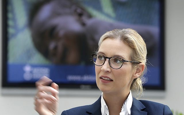 Alice Weidel of the German AfD (Alternative for Germany) party, sits in front of a news screen as she awaits a press conference in Berlin, Germany, August 21, 2017. (AP/Michael Sohn) Alice Weidel of the German AfD (Alternative for Germany) party, sits in front of a news screen as she awaits a press conference in Berlin, Germany, August 21, 2017. (AP/Michael Sohn)