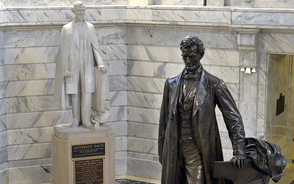 In this Wednesday, Aug. 5, 2015 file photo, a statue of Jefferson Davis, left, looks towards a statue of Abraham Lincoln in the Rotunda of the Kentucky State Capitol in Frankfort, Ky. (AP Photo/Timothy D. Easley) In this Wednesday, Aug. 5, 2015 file photo, a statue of Jefferson Davis, left, looks towards a statue of Abraham Lincoln in the Rotunda of the Kentucky State Capitol in Frankfort, Ky. (AP Photo/Timothy D. Easley)