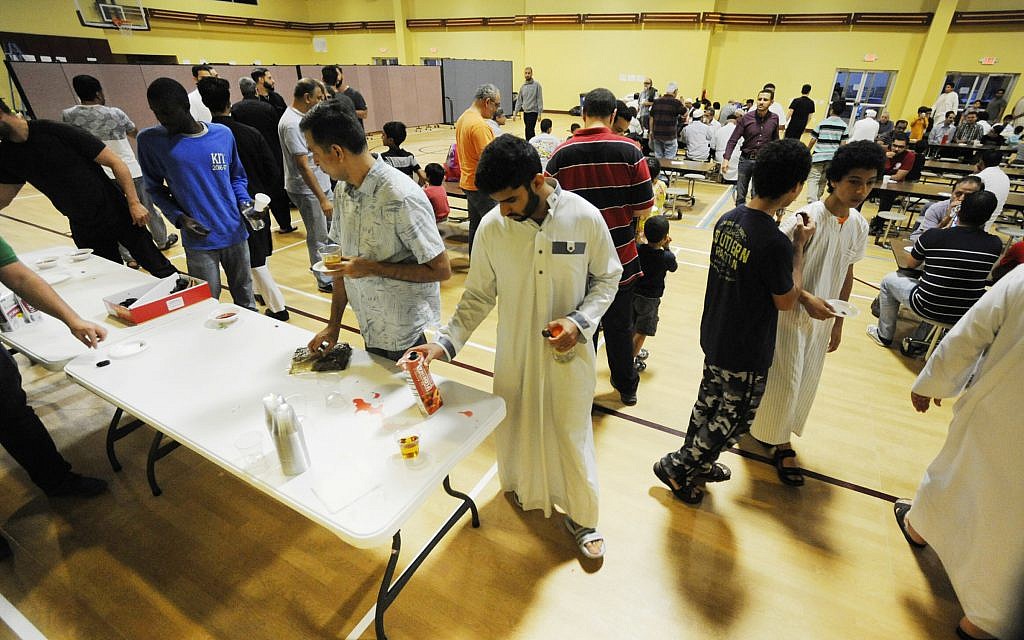 In this Thursday, Aug. 31, 2017, photo, Muslims at Champions Mosque gather for a meal at an Islamic holy day celebration. (AP Photo/Jay Reeves) In this Thursday, Aug. 31, 2017, photo, Muslims at Champions Mosque gather for a meal at an Islamic holy day celebration. (AP Photo/Jay Reeves)