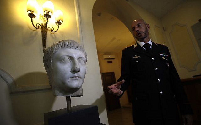 Italian Carabinieri officer Massimo Maresca shows the first century AC Druso marble head during an interview in the Carabinieri barracks, Friday, September 1, 2017 (AP/Alessandra Tarantino) Italian Carabinieri officer Massimo Maresca shows the first century AC Druso marble head during an interview in the Carabinieri barracks, Friday, September 1, 2017 (AP/Alessandra Tarantino)