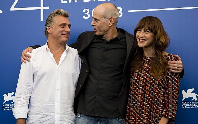Director Samuel Maoz, center, and actors Lior Ashkenazi, left, and Sarah Adler pose during the photo call for the film "Foxtrot" at the 74th Venice Film Festival in Venice, Italy, Saturday, Sept. 2, 2017. (AP Photo/Domenico Stinellis) Director Samuel Maoz, center, and actors Lior Ashkenazi, left, and Sarah Adler pose during the photo call for the film "Foxtrot" at the 74th Venice Film Festival in Venice, Italy, Saturday, Sept. 2, 2017. (AP Photo/Domenico Stinellis)