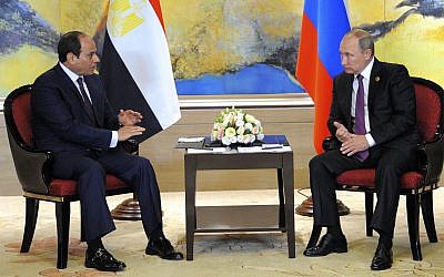 Russian President Vladimir Putin, right, and Egyptian President Abdel-Fattah el-Sissi hold a  bilateral meeting on the sidelines of the BRICS Summit in Xiamen, Fujian province, China, Monday, Sept. 4, 2017.(MENA via AP)