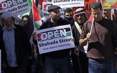 Palestinian activist Issa Amro participates in a demonstration in the West Bank city of Hebron, February 26, 2016. (AP Photo/Mahmoud Illean, File)