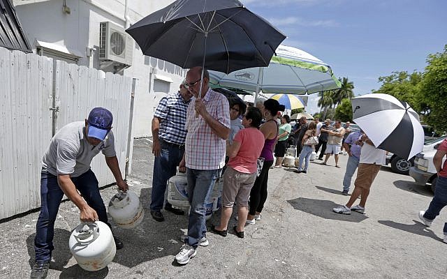 Residents stand in line to purchase propane gas as they prepare for Hurricane Irma, September 5, 2017, in Hialeah, Florida. (AP Photo/Alan Diaz) Residents stand in line to purchase propane gas as they prepare for Hurricane Irma, September 5, 2017, in Hialeah, Florida. (AP Photo/Alan Diaz)