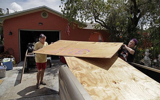 Stan Kreuter and his wife Jackie Kreuter prepare for Hurricane Irma, September 5, 2017, September 5, 2017, in Gulfport, Florida. (Lara Cerri/The Tampa Bay Times via AP) Stan Kreuter and his wife Jackie Kreuter prepare for Hurricane Irma, September 5, 2017, September 5, 2017, in Gulfport, Florida. (Lara Cerri/The Tampa Bay Times via AP)