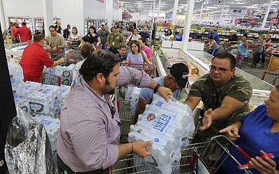 Residents purchase water at BJ Wholesale in preparation for Hurricane Irma, September 5, 2017, in Miami. (Roberto Koltun/Miami Herald via AP)