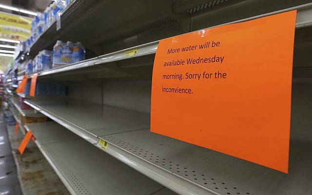 A shelf normally containing packaged water is empty at a Piggly Wiggly store Tueday, September 5, 2017, in Panama City, Florida. (Patti Blake/News Herald via AP) A shelf normally containing packaged water is empty at a Piggly Wiggly store Tueday, September 5, 2017, in Panama City, Florida. (Patti Blake/News Herald via AP)