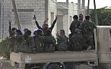 File: Arab and Kurdish fighters with the US-backed Syrian Democratic Forces move toward the front line to battle against the Islamic State militants, in Raqqa, northeast Syria, July 22, 2017. (AP/Hussein Malla, File)