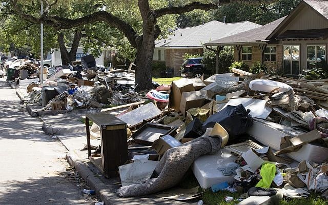 Flood damaged debris from homes lines the street in the aftermath of Hurricane Harvey on Thursday, Sept. 7, 2017, in Houston. (AP Photo/Matt Rourke) Flood damaged debris from homes lines the street in the aftermath of Hurricane Harvey on Thursday, Sept. 7, 2017, in Houston. (AP Photo/Matt Rourke)