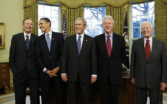 In this January 7, 2009, photo, then-President-elect Barack Obama is welcomed by then-President George W. Bush for a meeting at the White House in Washington, Wednesday, Jan. 7, 2009, with former presidents, from left, George H.W. Bush, Bill Clinton and Jimmy Carter. (AP Photo/J. Scott Applewhite, File) In this January 7, 2009, photo, then-President-elect Barack Obama is welcomed by then-President George W. Bush for a meeting at the White House in Washington, Wednesday, Jan. 7, 2009, with former presidents, from left, George H.W. Bush, Bill Clinton and Jimmy Carter. (AP Photo/J. Scott Applewhite, File)