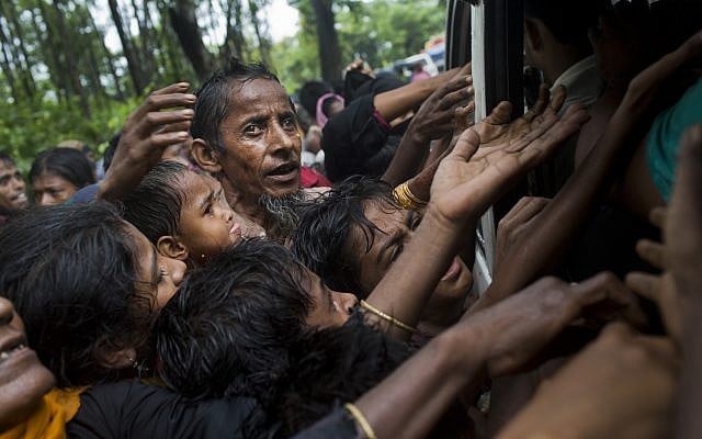 Rohingya scuffle to get aid from local volunteers at Kutupalong, Bangladesh, Friday, Sept. 8, 2017. (AP Photo/Bernat Armangue) Rohingya scuffle to get aid from local volunteers at Kutupalong, Bangladesh, Friday, Sept. 8, 2017. (AP Photo/Bernat Armangue)