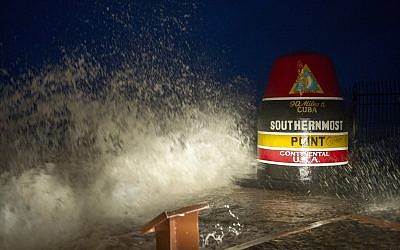 As Hurricane Irma swirled toward Florida, waves crash against the southernmost point in Key West, Florida, September 9, 2017.  (Rob O'Neal/The Key West Citizen via AP)