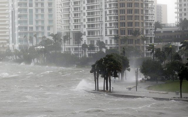 Waves crash over a seawall at the mouth of the Miami River from Biscayne Bay, Florida., as Hurricane Irma passes by, Sempember 10, 2017, in Miami. (AP Photo/Wilfredo Lee)