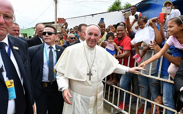 Pope Francis greets the faithful with a bruise on his face, after he knocked his head on the popemobile, in Cartagena, Colombia, September 10, 2017. (Alberto Pizzoli/Pool via AP)