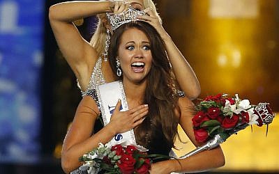 Miss North Dakota Cara Mund reacts after being named Miss America during Miss America 2018 pageant, Sunday, Sept. 10, 2017, in Atlantic City, N.J. (AP Photo/Noah K. Murray)