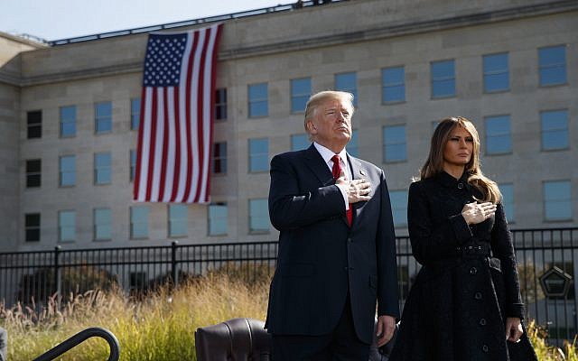 President Donald Trump and First Lady Melania Trump stand, as "Taps" is played during a ceremony to mark the anniversary of the September 11 terrorist attacks, on that day in 2017, at the Pentagon. (AP Photo/Evan Vucci) President Donald Trump and First Lady Melania Trump stand, as "Taps" is played during a ceremony to mark the anniversary of the September 11 terrorist attacks, on that day in 2017, at the Pentagon. (AP Photo/Evan Vucci)