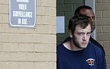 Kenneth James Gleason is escorted by police to a waiting police car in Baton Rouge, Louisiana, Tuesday, Sept. 19, 2017. (AP Photo/Gerald Herbert)
