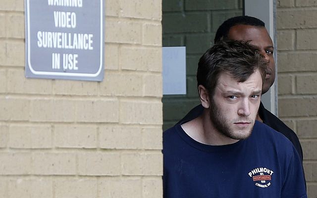 Kenneth James Gleason is escorted by police to a waiting police car in Baton Rouge, Louisiana, Tuesday, Sept. 19, 2017. (AP Photo/Gerald Herbert) Kenneth James Gleason is escorted by police to a waiting police car in Baton Rouge, Louisiana, Tuesday, Sept. 19, 2017. (AP Photo/Gerald Herbert)